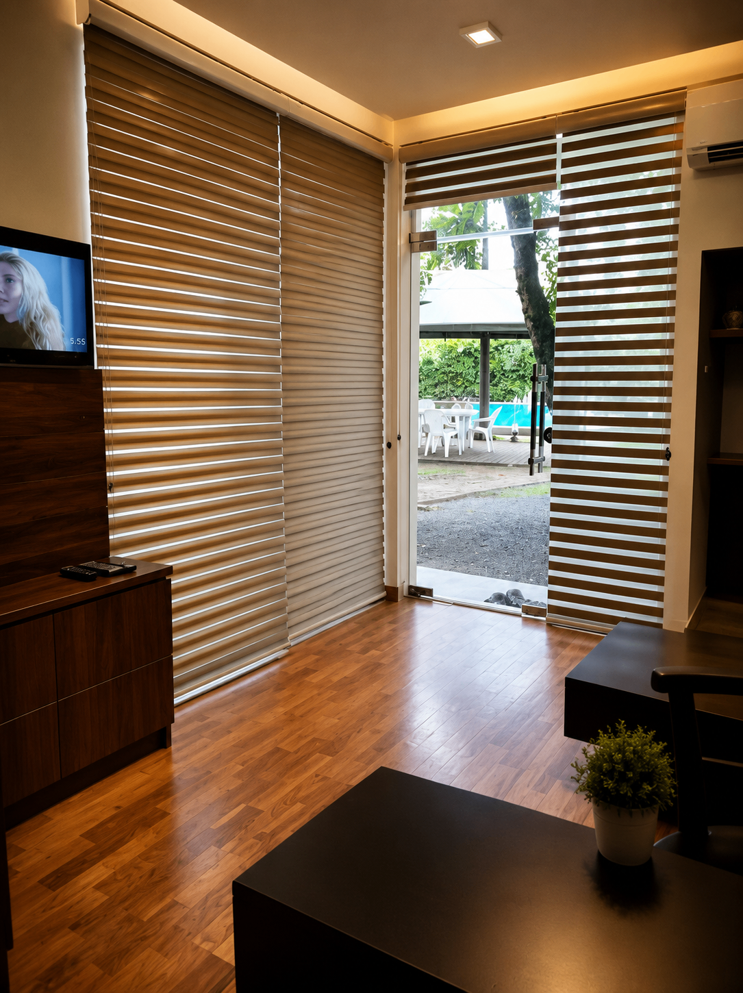 Oak Suite With Jacuzzi opening toward an outdoor seating area and poolside garden