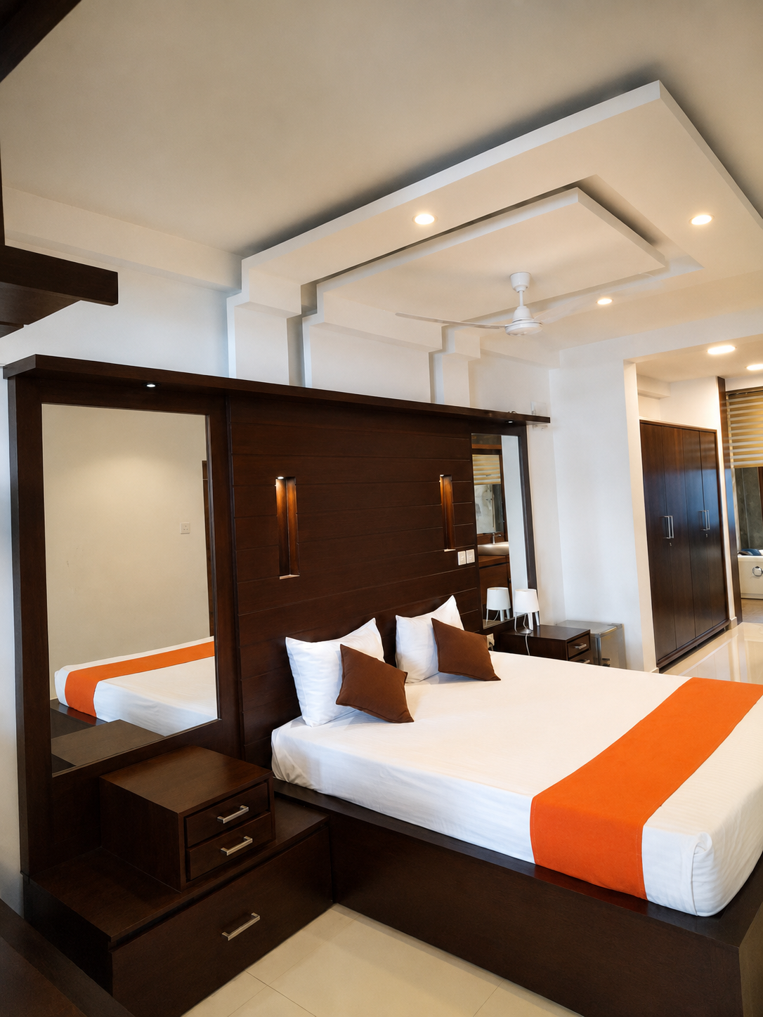 Bedroom with dark wood headboard and crisp white linens